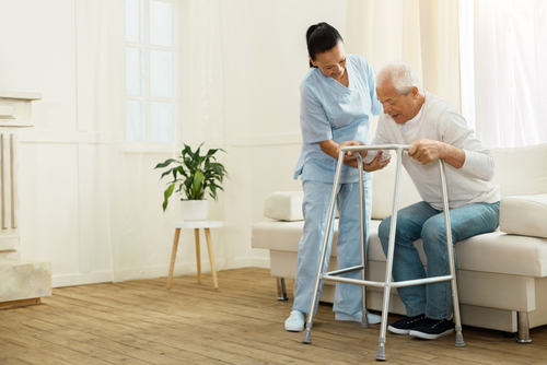 caregiver helping her patient