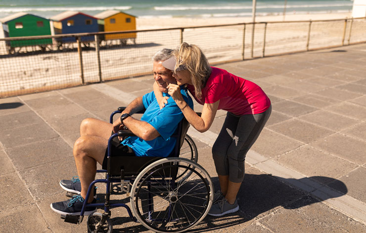 hugging man in wheelchair