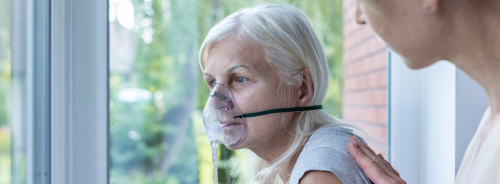 senior woman with oxygen mask