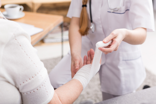 closeup nurse changing bandage