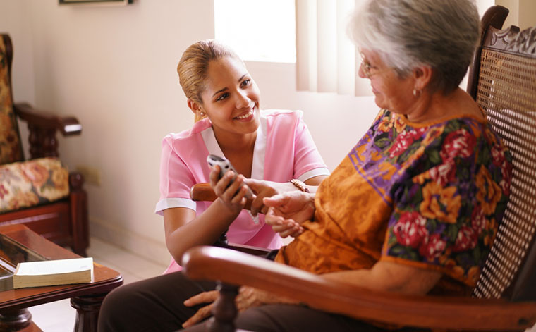 caregiver checking senior eyesight