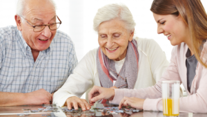 seniors older adults playing games doing a puzzle